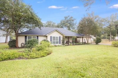 Ranch-style home with a front yard | Image 1