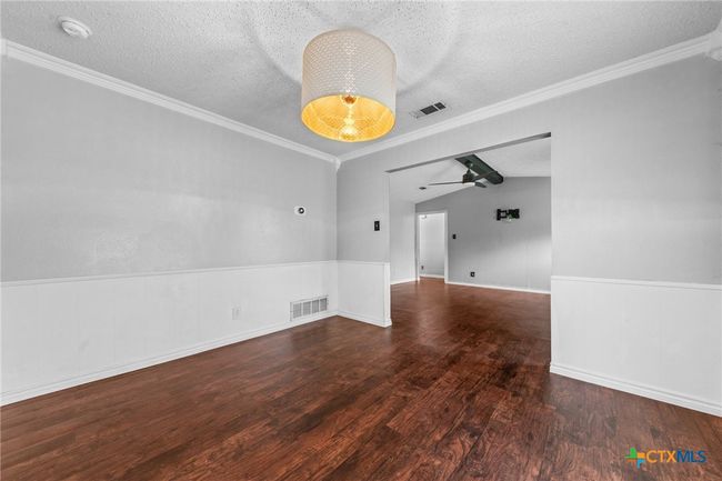 Dining area to living room | Image 9