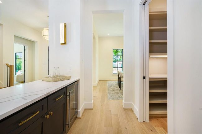 Pass through bar and custom pantry will make hosting a touch easier. | Image 8