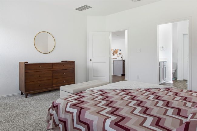 Bedroom featuring ensuite bathroom and visible vents | Image 21