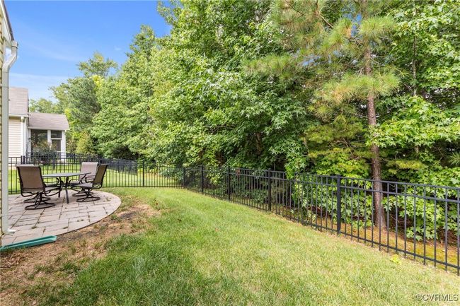 Fenced backyard featuring a patio area | Image 36