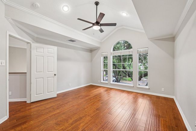 Natural light and wood flooring continue throughout each upstairs bedroom. | Image 24