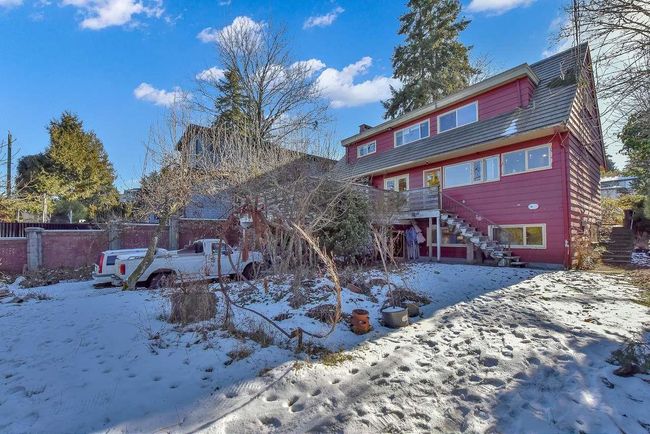 Snow covered house with stairs and a chimney | Image 37