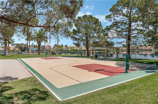 View of sport court with community basketball court and a water view | Image 42
