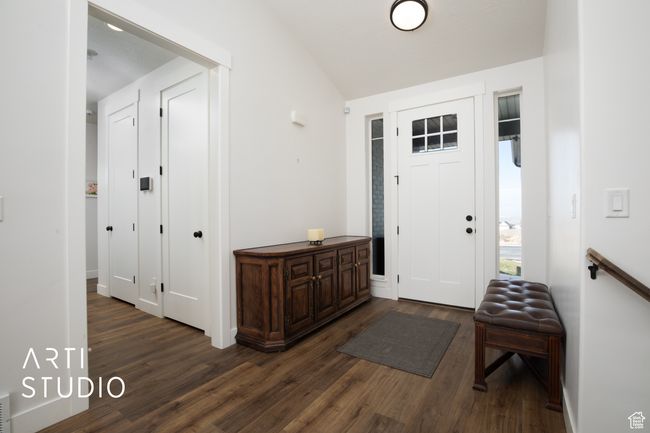 Entrance foyer with dark wood-type flooring and vaulted ceiling | Image 18