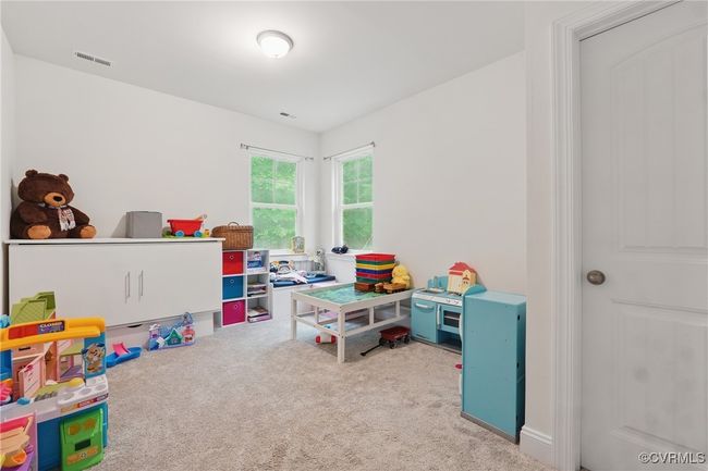 Spacious first-floor guest suite with natural light and easy bath access. | Image 12