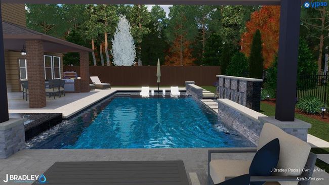 A covered outdoor kitchen sits just steps from the pool—perfect for flipping burgers and chatting with guests while they splash around. | Image 35