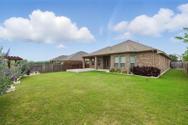 The backyard offers plenty of space for gardening, play equipment, or future outdoor enhancements. | Image 31
