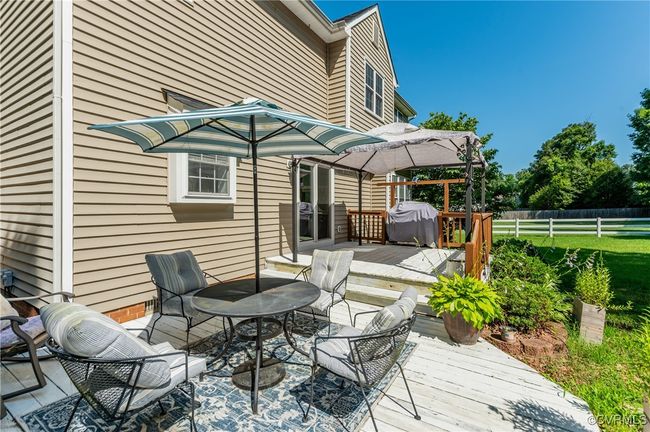 Deck with grilling area and outdoor dining space | Image 43