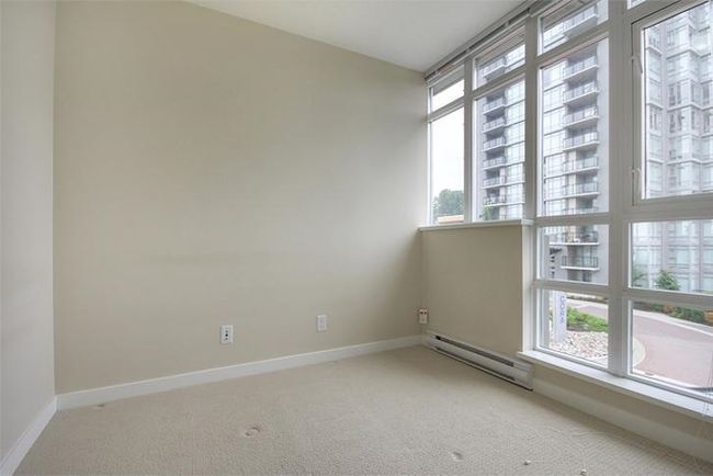 Carpeted empty room featuring baseboards and baseboard heating | Image 19