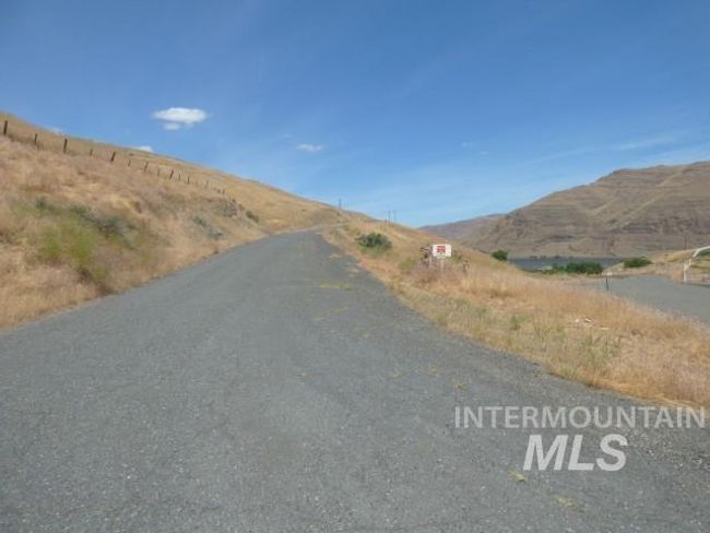 View of asphalt street with a mountain view | Image 9