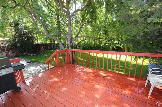 Deck featuring a fenced backyard | Image 7