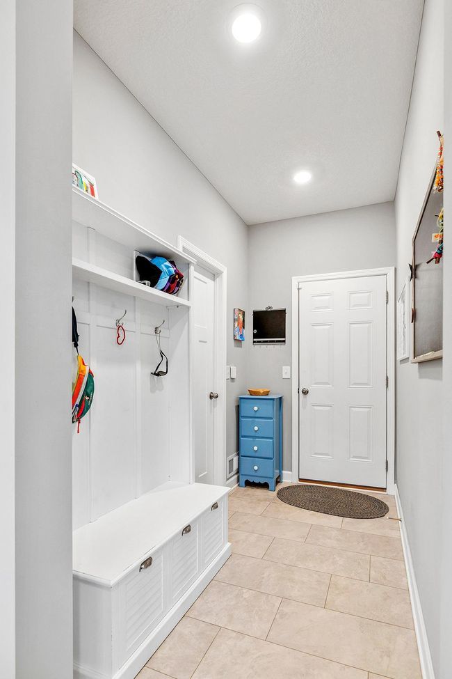 Mudroom leading to 3 car garage. | Image 18