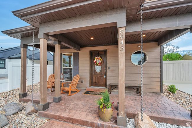 Doorway to property featuring fence and covered porch | Image 4