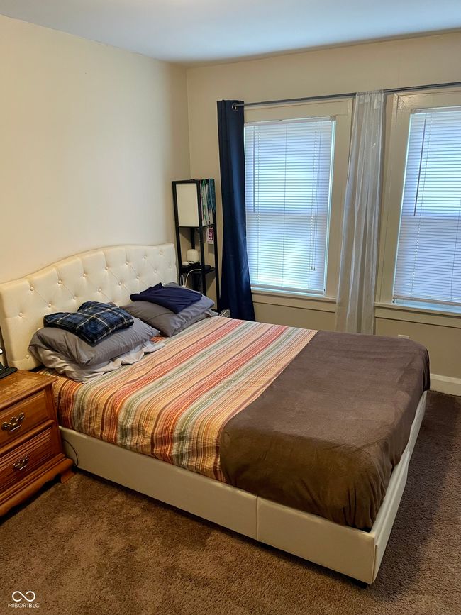 bedroom with multiple windows and carpet | Image 12