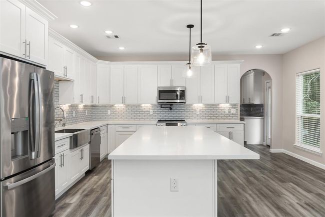 A second view of the kitchen with butler's pantry in the back right | Image 7