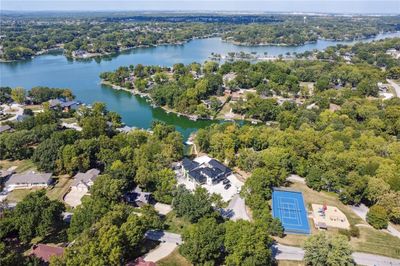 Aerial View featuring nearby amenities including lake, tennis/pickleball courts & Thompson Park | Image 2