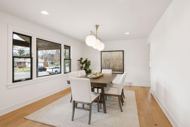 Huge dining area has lots of natural light and is big enough to host large gatherings. | Image 7