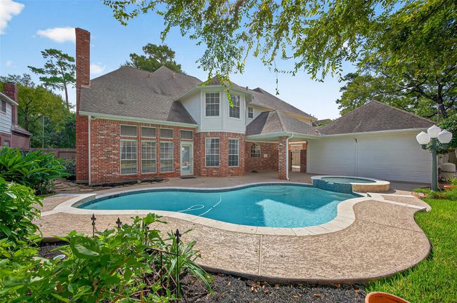 Pool and Spa with recent aesthetic upgrades including tile, coping and water features. | Image 43