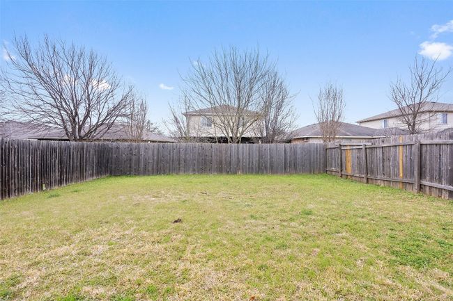 View of fenced backyard | Image 33