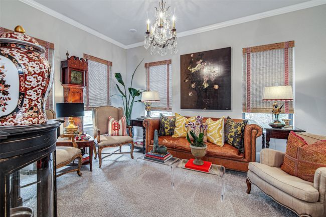 Living room featuring carpet, a notable chandelier, and ornamental molding | Image 17