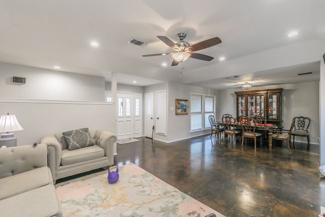 Unit 4904 Living room featuring ceiling fan | Image 25