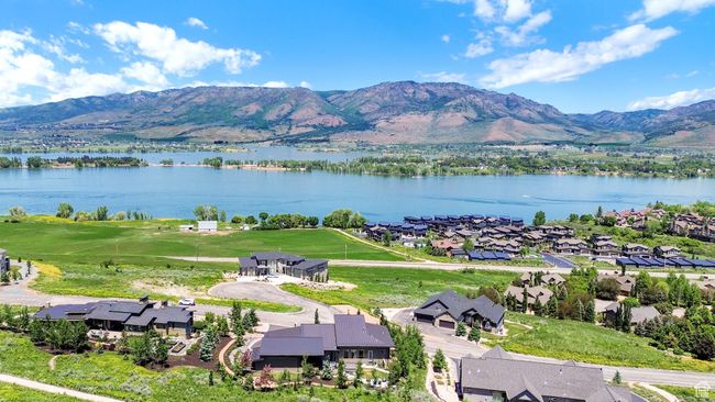Aerial view of residential area featuring a water and mountain view | Image 115