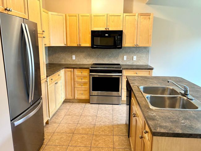 703 - 620 Luxstone Landing Sw, Townhouse with 3 bedrooms, 3 bathrooms and 2 parking in Airdrie AB | Image 6