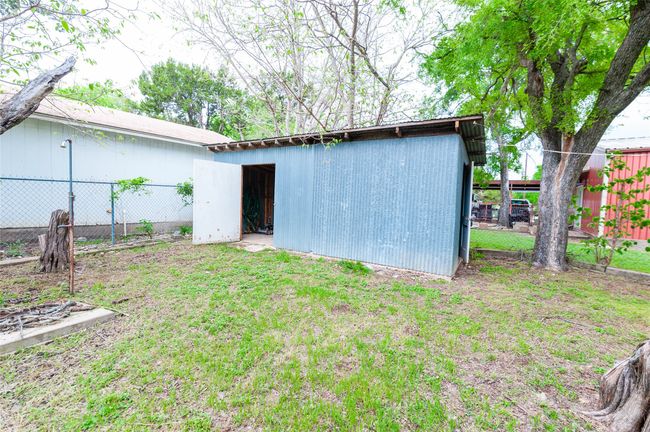View of pole building with fence and a lawn | Image 28