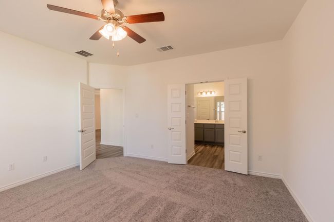 Unfurnished bedroom featuring carpet flooring, visible vents, and baseboards | Image 18