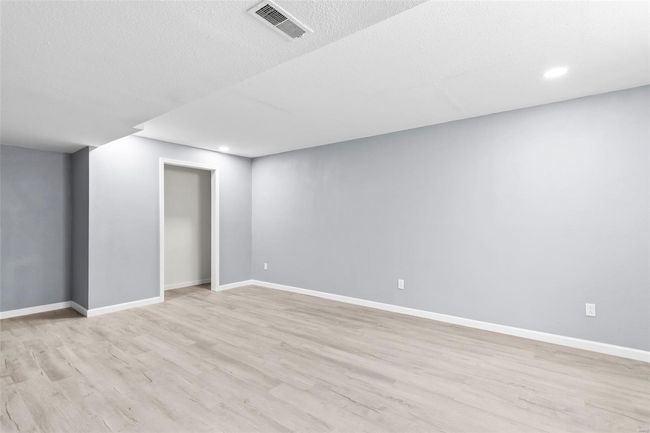 Washroom with electric dryer hookup, wood finished floors, washer hookup, and baseboards | Image 22