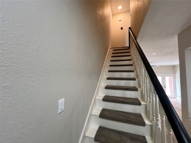 Stairs with a textured wall | Image 16