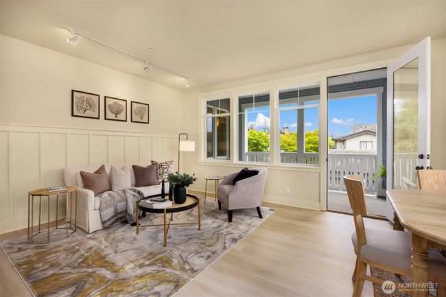 Living area with door to covered deck! NEW LVP flooring! | Image 9