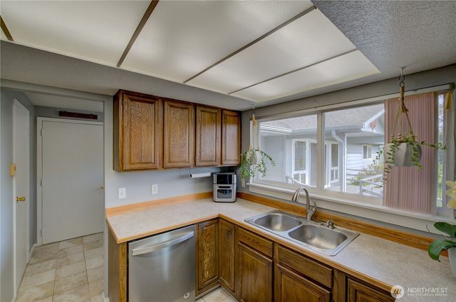 Looking through the kitchen through the Utility room, walk in pantry and garage. | Image 15