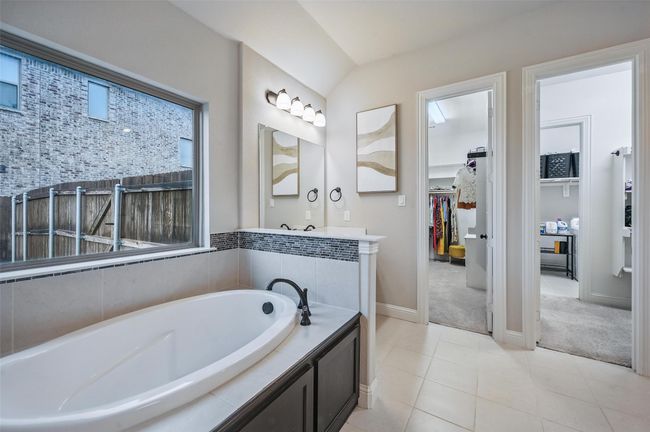 Bathroom featuring a bath, a spacious closet, and tile patterned floors | Image 27