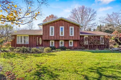 Split-level home with a front lawn | Image 1