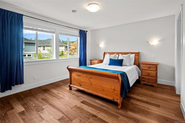Bedroom featuring wood finished floors | Image 35