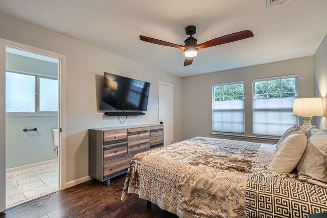 Bedroom featuring dark wood finished floors and ceiling fan | Image 14