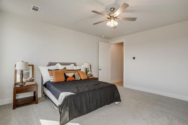 Carpeted bedroom with ceiling fan | Image 20