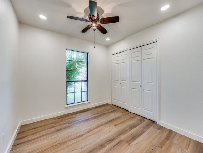 Unfurnished bedroom featuring light wood-type flooring, recessed lighting, a ceiling fan, and a closet | Image 14