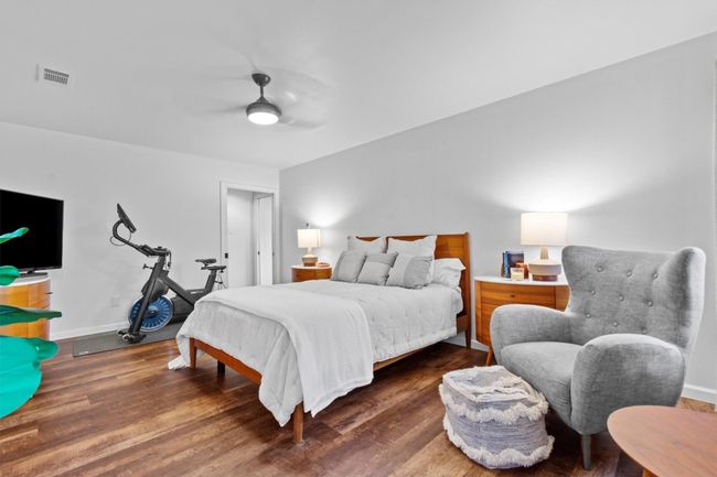 Bedroom featuring ceiling fan and dark hardwood / wood-style flooring | Image 15
