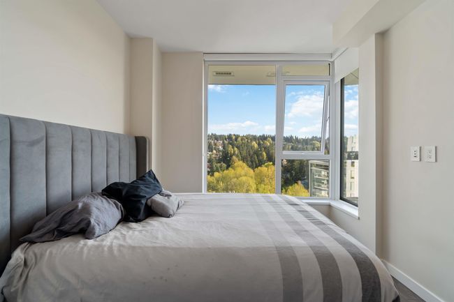 Bedroom with baseboards and visible vents | Image 17
