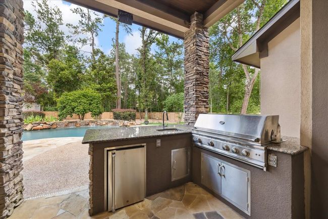 Refrigerator, Sink and Outdoor Grill Overlooking The One Acre Lot and Pool | Image 42
