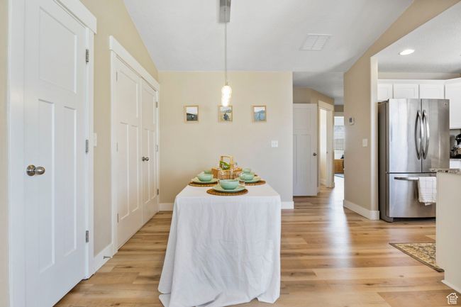 Dining space featuring baseboards, light wood-type flooring, and recessed lighting | Image 11
