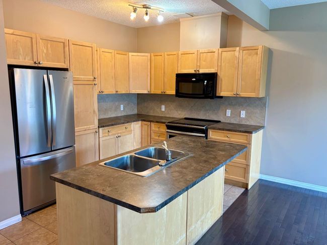 703 - 620 Luxstone Landing Sw, Townhouse with 3 bedrooms, 3 bathrooms and 2 parking in Airdrie AB | Image 4