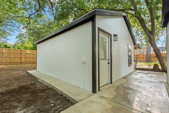 View of outbuilding featuring a fenced backyard | Image 23