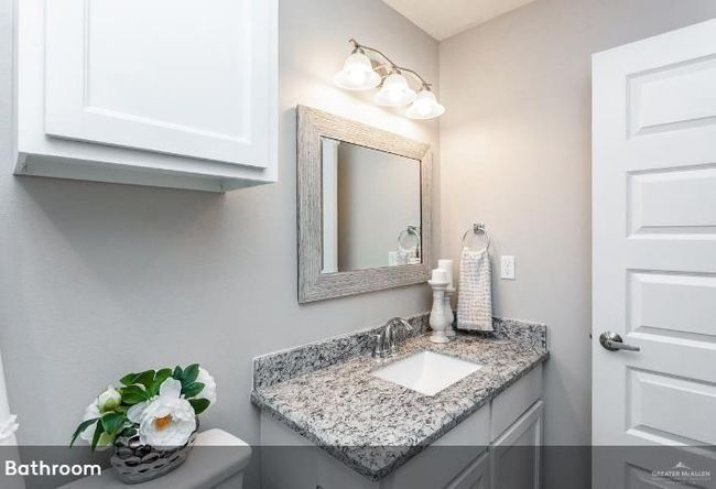 Half bathroom featuring vanity and toilet | Image 5
