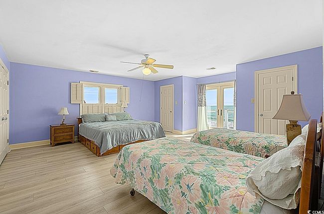 Bedroom featuring visible vents, baseboards, access to outside, french doors, and light wood finished floors | Image 35