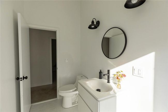 Bathroom featuring tile patterned floors, vanity, and toilet | Image 14