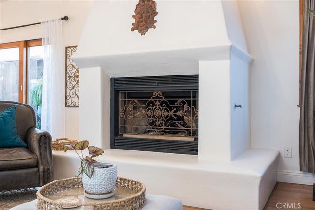 Large custom Spanish style fireplace, perfect for cozy evenings in | Image 12